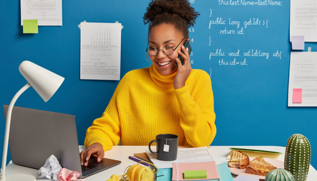 professional-web-editor-creats-technical-stucture-website-discusses-some-working-issues-via-smartphone-wears-spectacles-surfs-internet-modern-laptop